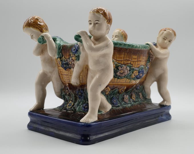 Majolica centerpiece / Jardinière carried by Cherubs, Art Nouveau