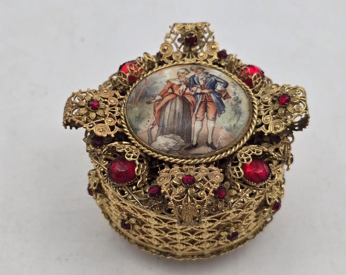 Small antique jewelry box with locket