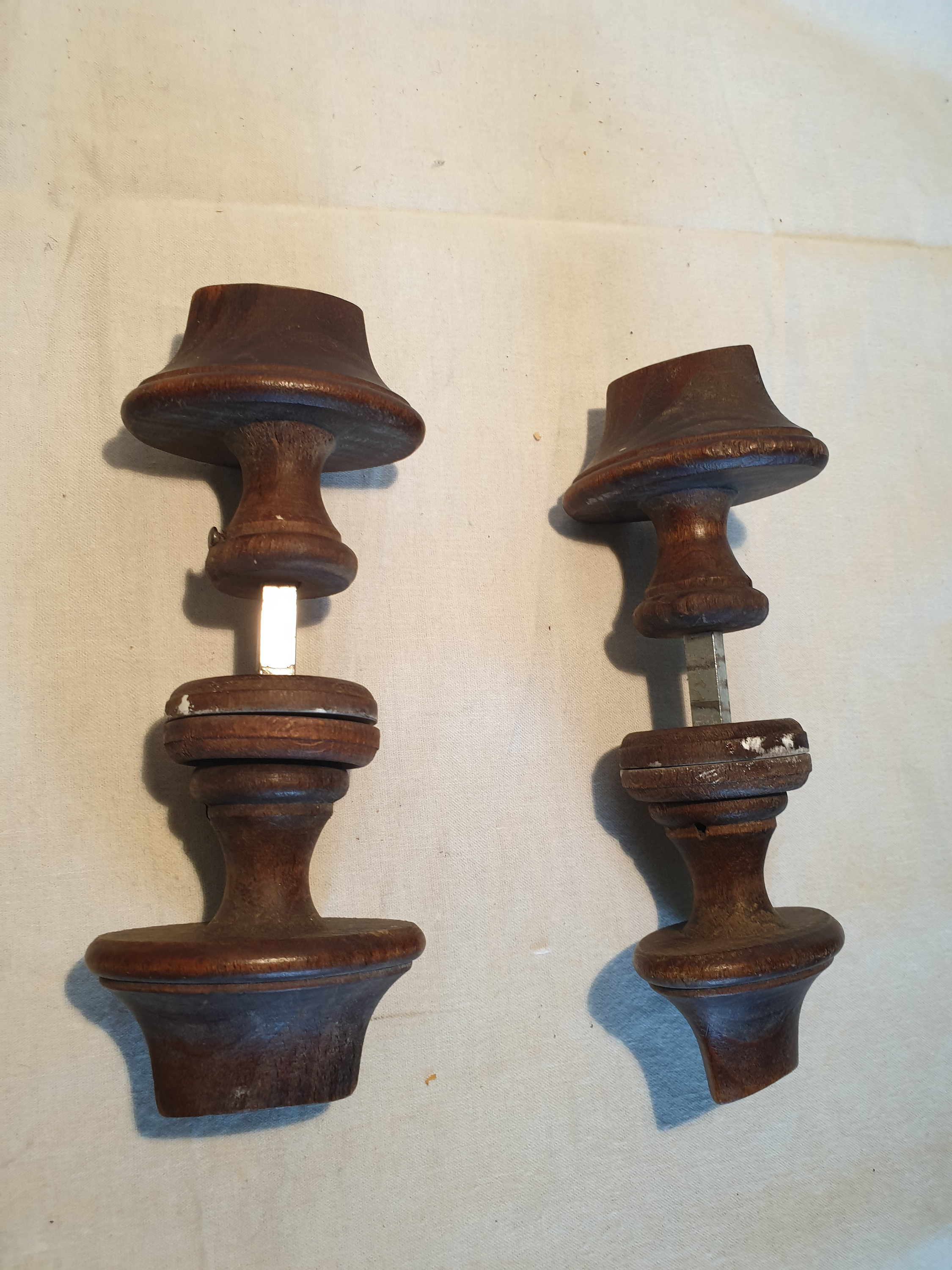 Set of two antique wooden door handles, complete with rosettes