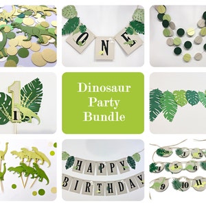 May include: A dinosaur party bundle with green and gold decorations. The bundle includes a banner that says "Happy Birthday", a garland with green leaves, a garland with green and gold circles, a cake topper with a number one and a dinosaur, and dinosaur cupcake toppers.