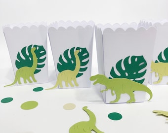 Mini cajas de palomitas de maíz con temática de dinosaurios: un detalle perfecto para fiestas de cumpleaños con dinosaurios.