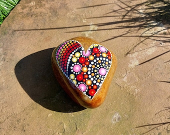 painted pebble with mandala heart dot art