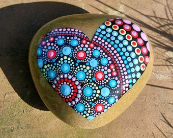 painted pebble with mandala heart dot art