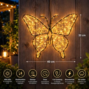Könnte beinhalten: Eine LED-Lichtdekoration in Schmetterlingsform mit schwarzem Drahtrahmen und warmweißen Lichtern. Das Display misst 32 cm in der Höhe und 40 cm in der Breite. Es verfügt über 400 LEDs, Blitzfunktion, Dimmer, 8h-Timer, 5 m Zuleitung und ist wetterfest für den Außenbereich.