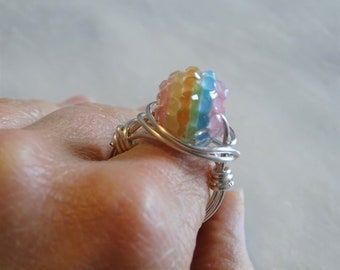 Wire wrapped Rainbow bead, using a silver plated wire.