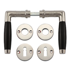 May include: A set of polished nickel door handles with black wooden knobs. The handles are designed with a traditional style and include two sets of round escutcheons.