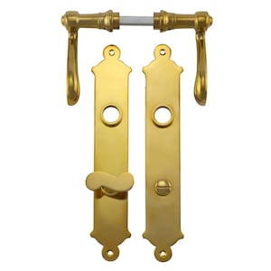 May include: A set of gold door hardware with a lever handle, a deadbolt, and a decorative plate. The hardware has a traditional design with a curved lever handle and a round deadbolt.