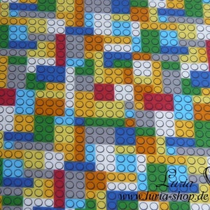 Puede incluir: Una tela colorida con un patr&oacute;n repetitivo de cuadrados de diferentes colores, cada uno lleno de peque&ntilde;os c&iacute;rculos blancos. Los cuadrados est&aacute;n dispuestos en un patr&oacute;n aleatorio, creando un dise&ntilde;o alegre y moderno.