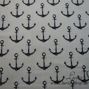 May include: A white fabric with a repeating pattern of black anchor designs. The anchors are stylized and have a distressed look.