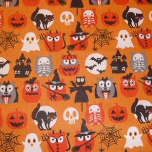May include: Orange fabric with a Halloween pattern featuring black cats, pumpkins, ghosts, bats, owls, skulls, and houses. The fabric has a vintage feel.