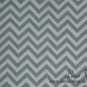 Könnte beinhalten: Grauer und weißer Chevron-Stoff. Der Stoff hat eine dezente Textur und ein sich wiederholendes Muster aus abwechselnd grauen und weißen Zickzacklinien.