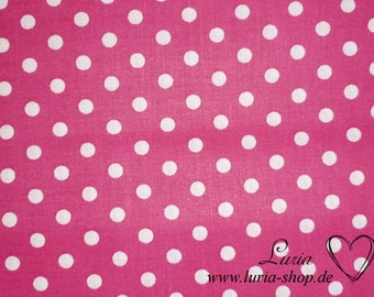 May include: A close-up of a pink fabric featuring a repeating pattern of white polka dots. The fabric has a smooth texture and the dots are evenly spaced. The image includes the text "Luria www.luria-shop.de" with a heart symbol.
