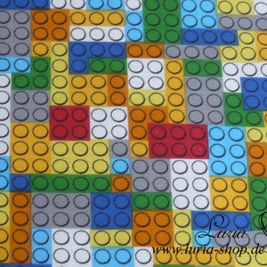 Puede incluir: Una tela colorida con un patr&oacute;n repetitivo de cuadrados de diferentes colores. Cada cuadrado est&aacute; lleno de un patr&oacute;n de peque&ntilde;os c&iacute;rculos. Los colores incluyen rojo, naranja, amarillo, verde, azul y gris.