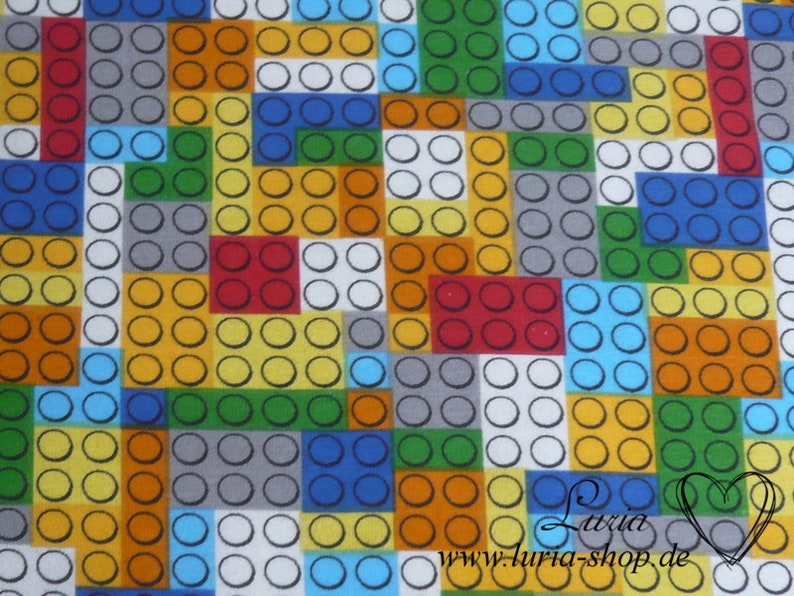 Puede incluir: Una tela colorida con un patr&oacute;n repetitivo de cuadrados de diferentes colores. Cada cuadrado est&aacute; lleno de un patr&oacute;n de peque&ntilde;os c&iacute;rculos. Los colores incluyen rojo, naranja, amarillo, verde, azul y gris.