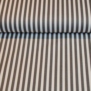 May include: Black and white striped fabric with a subtle sheen. The fabric is folded in half, showing the pattern on both sides.