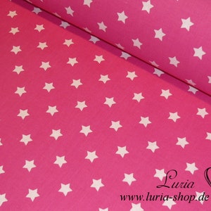 May include: Pink fabric with a white star pattern. The fabric is rolled up and the text "Luria www.luria-shop.de" is visible at the bottom.