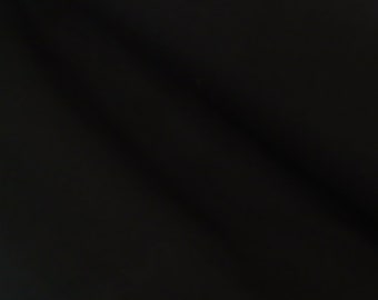 May include: A dark, abstract image with diagonal lines and shadows. The image is predominantly black, with subtle variations in tone and texture. The overall effect is minimalist and modern.