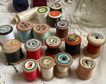 Decoration idea sewing table 19 x wooden thread spools in old jar