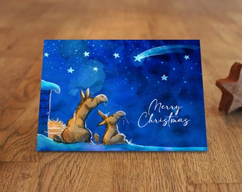 Christmas card - donkey under the poinsettia