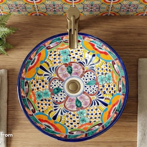 Stunning bathroom featuring a colorful Mexican hand-painted Talavera sink by MexAmbiente in Germany.