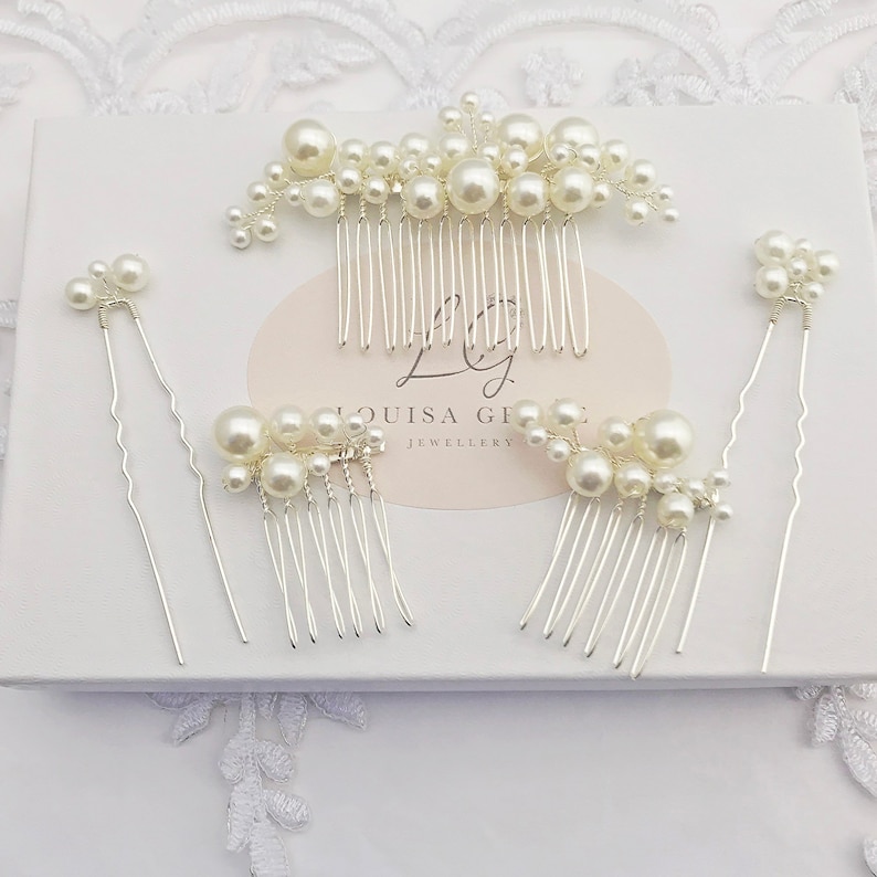 hand crafted three dainty hair combs and two pins for a bride and bridesmaids, embellished with a multitude of simulated ivory pearls, with a polished silver plated finish