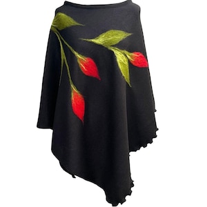 May include: Black poncho with a floral design featuring red and green flowers.