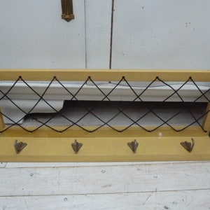 large antique wardrobe with hat rack