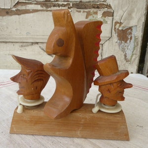 2 carved ornaments - corks in the holder