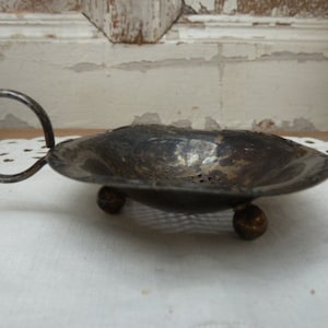 silver-plated tea strainer