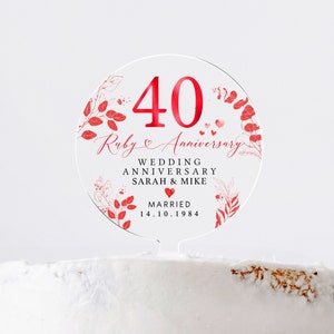 May include: Round red and white cake topper with the text "40 Ruby Anniversary" and "Wedding Anniversary Sarah & Mike Married 14.10.1984".
