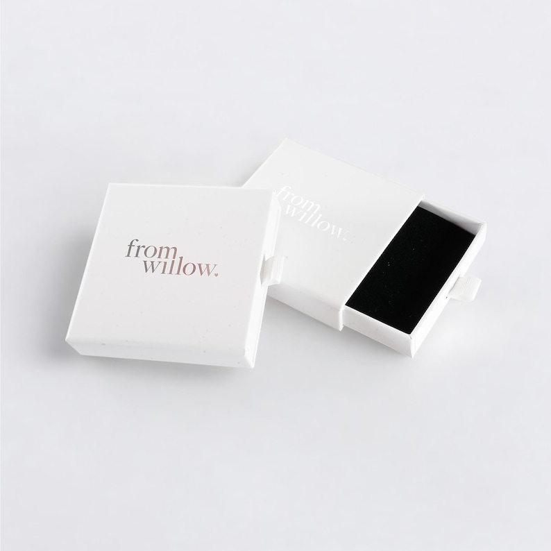a white box with a black square inside of it