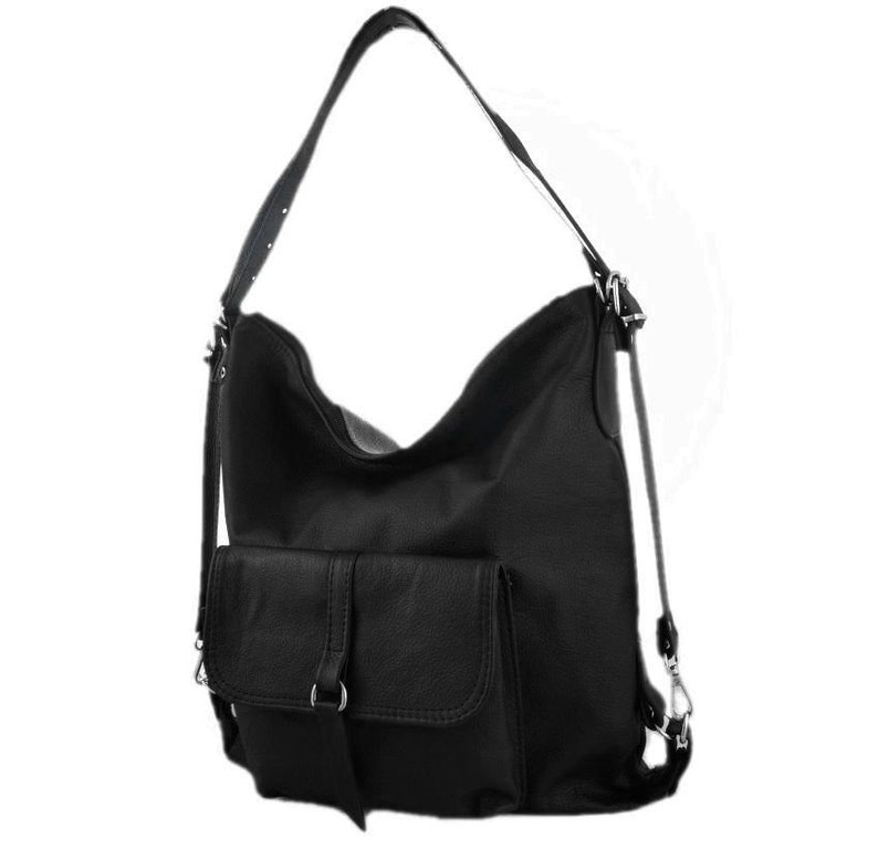 May include: Black leather shoulder bag with a large main compartment and a front pocket. The bag has a long adjustable strap and a shorter handle. The bag can be worn as a shoulder bag or a backpack.
