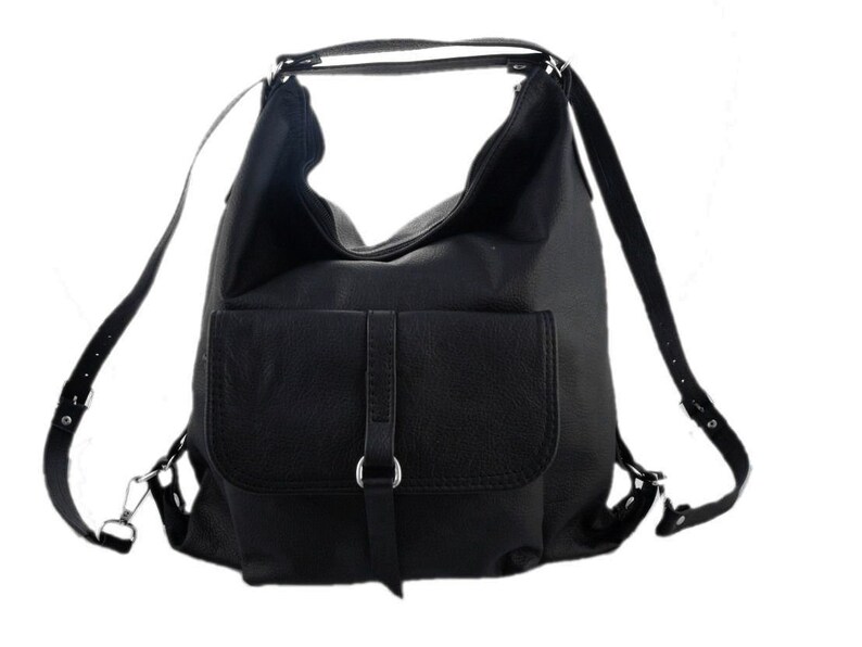 May include: Black leather backpack with a large main compartment and a front flap pocket. The bag has adjustable shoulder straps and a top handle. The hardware is silver-toned. The bag is designed to be worn as a backpack or carried as a shoulder bag.