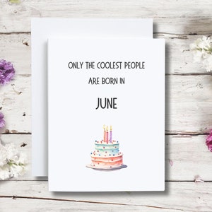 May include: A white card with the text "Only the coolest people are born in June" and a watercolor illustration of a three-tiered birthday cake with candles.