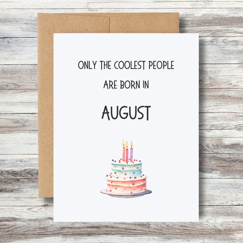 May include: A white card with the text "Only the coolest people are born in August" and a watercolor illustration of a pink and blue birthday cake with candles.