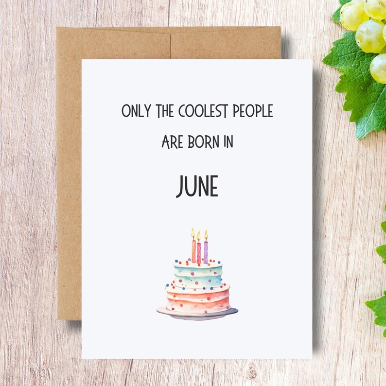 May include: A white card with the text "ONLY THE COOLEST PEOPLE ARE BORN IN JUNE" and a watercolor illustration of a three-tiered birthday cake with candles.