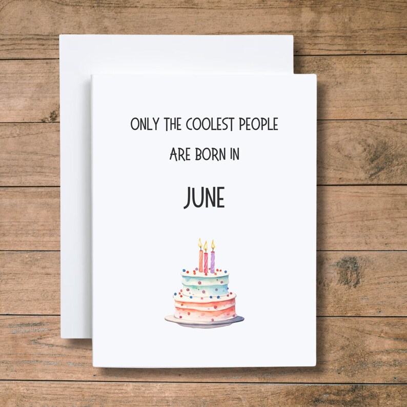 May include: A white card with the text "Only the coolest people are born in June" and a watercolor illustration of a birthday cake with candles.