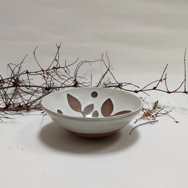 NATURAL BEAUTY: Hand potted unique white ceramic bowl with dark leaf motif and dots