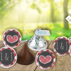 May include: A set of wedding favor chocolate kisses with personalized wrappers. The wrappers feature a red and white checkered pattern with a heart and the text "E & J" or "I do!"