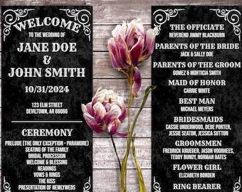 May include: Two vertical black wedding program cards with white text and ornate corner flourishes. The left card lists the wedding of Jane Doe and John Smith on 10/31/2024, while the right card lists the wedding party. Two dried purple tulips sit between them.