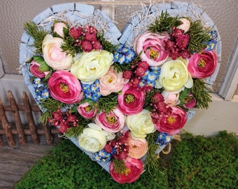 Wooden heart in grey with colorful flower meadow, Mother's Day