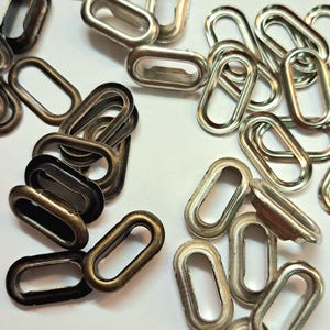 Œillets métalliques 15 mm, lot de 2 avec rondelles, œillets ovales, aspect argenté, plats, pour cordons de serrage de sweats à capuche, de pantalons et de pantalons