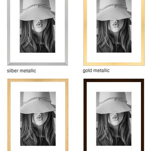 May include: Four different picture frames with a black and white photo of a woman wearing a hat. The frames are silver metallic, gold metallic, natural wood, and dark brown.