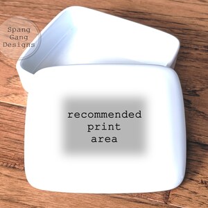 May include: White ceramic box with a lid. The box has the text "recommended print area" printed on the front.