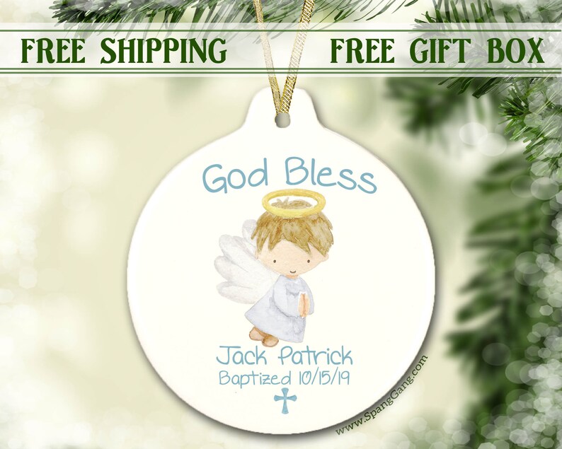 May include: White ceramic ornament with a blue and yellow angel illustration. The ornament says "God Bless" and "Jack Patrick Baptized 10/15/19".