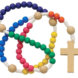 May include: A colourful wooden rosary with blue, green, pink, yellow and orange beads. The rosary has a wooden cross.