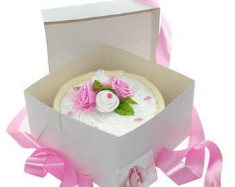 Mima el pañal pastel rosa para niñas en caja de pasteles