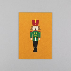 Postkarte, Holzschliffpappe, Weihnachten, Merry Christmas, Nussknacker // Postkarte Walter Orange