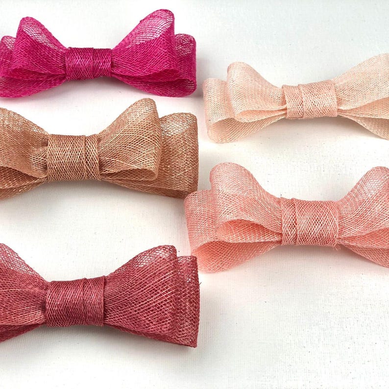 May include: A set of three ceramic mugs with a speckled, matte finish. The mugs are in shades of cream, light gray, and dark gray. Each mug has a simple, minimalist design, perfect for coffee or tea.