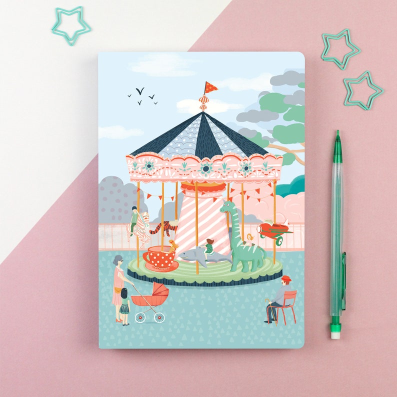 May include: A colorful illustration of a carousel with a pink and white striped roof, a blue and white striped canopy, and a variety of animals, including a zebra, a dinosaur, and a shark. There are people standing around the carousel, including a woman pushing a stroller.